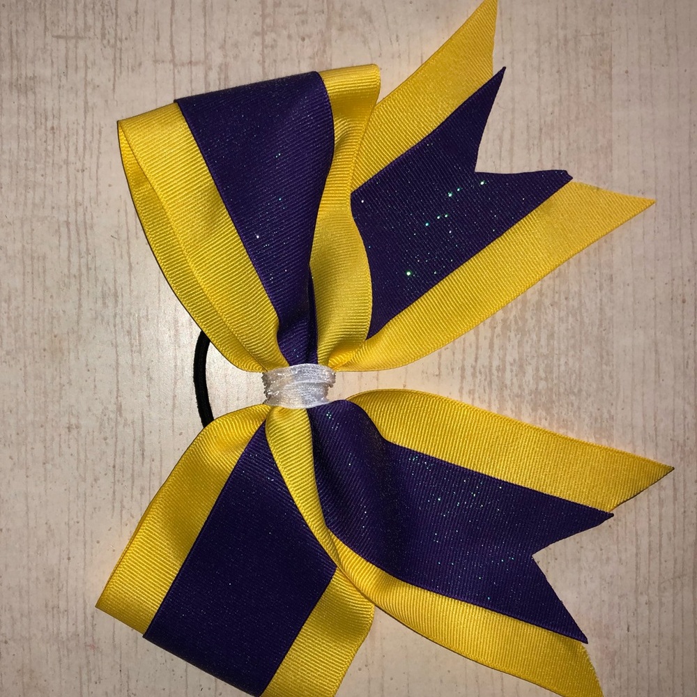 purple and gold cheerleading bow